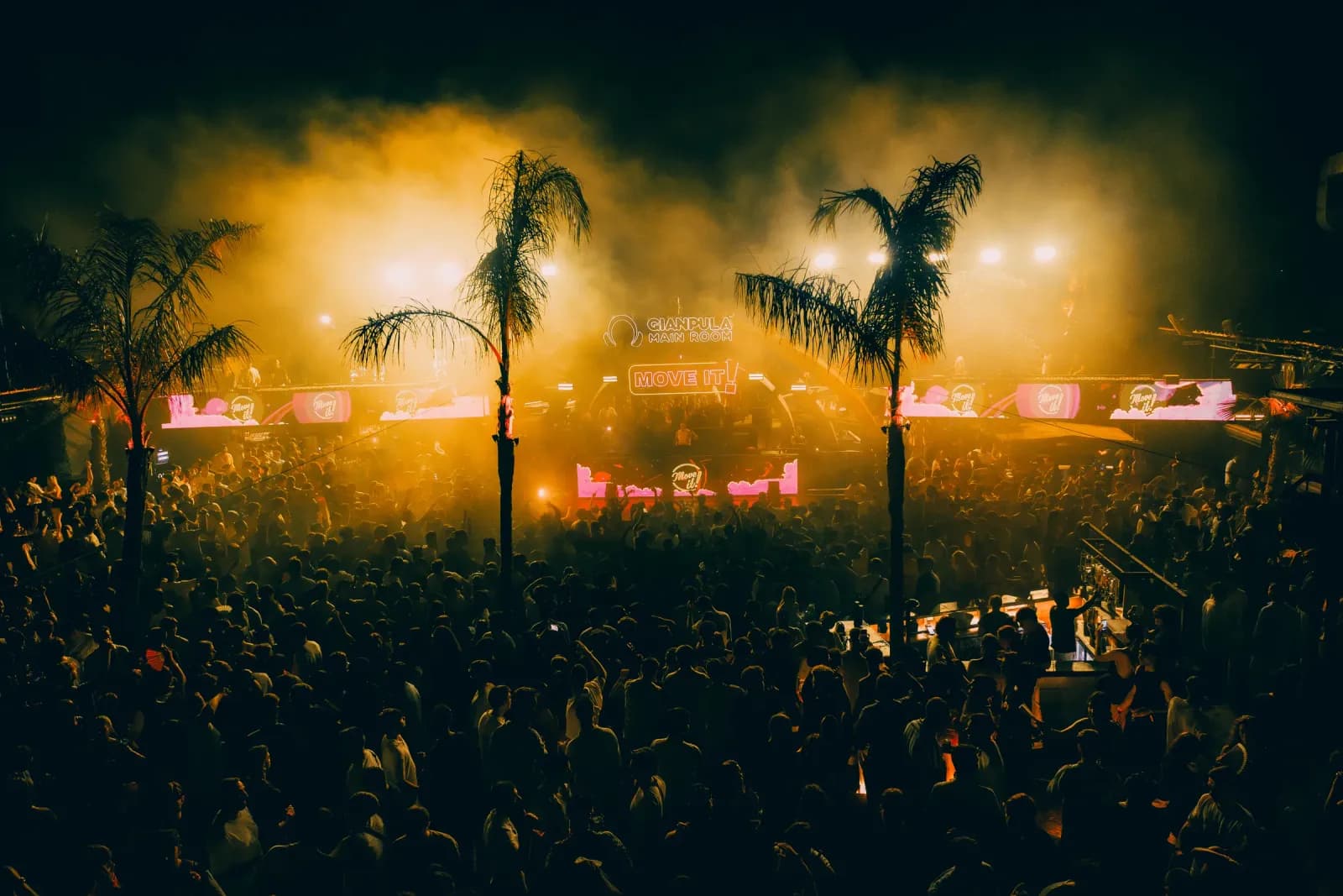 Open-air Main Room at Gianpula Village during Move it! Malta, with palm trees and golden lights